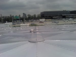 Aluminum Geotruss Reservoir Cover with freeway in background