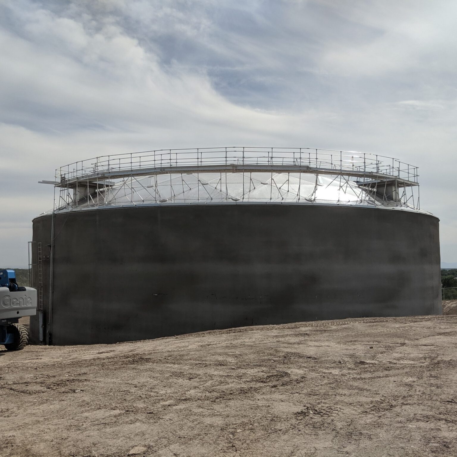 Concrete storage tank with aluminum geodesic dome