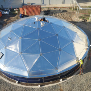 Aluminum Dome panels with workers showing through and opening in the top of the roof.