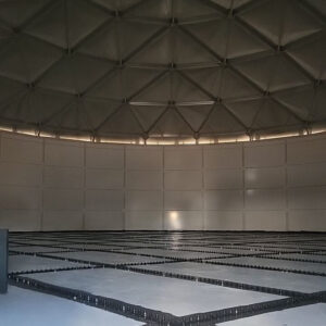 White panels inside a dry water tank, bolts, on floor, black sealant, silver triangular dome panels